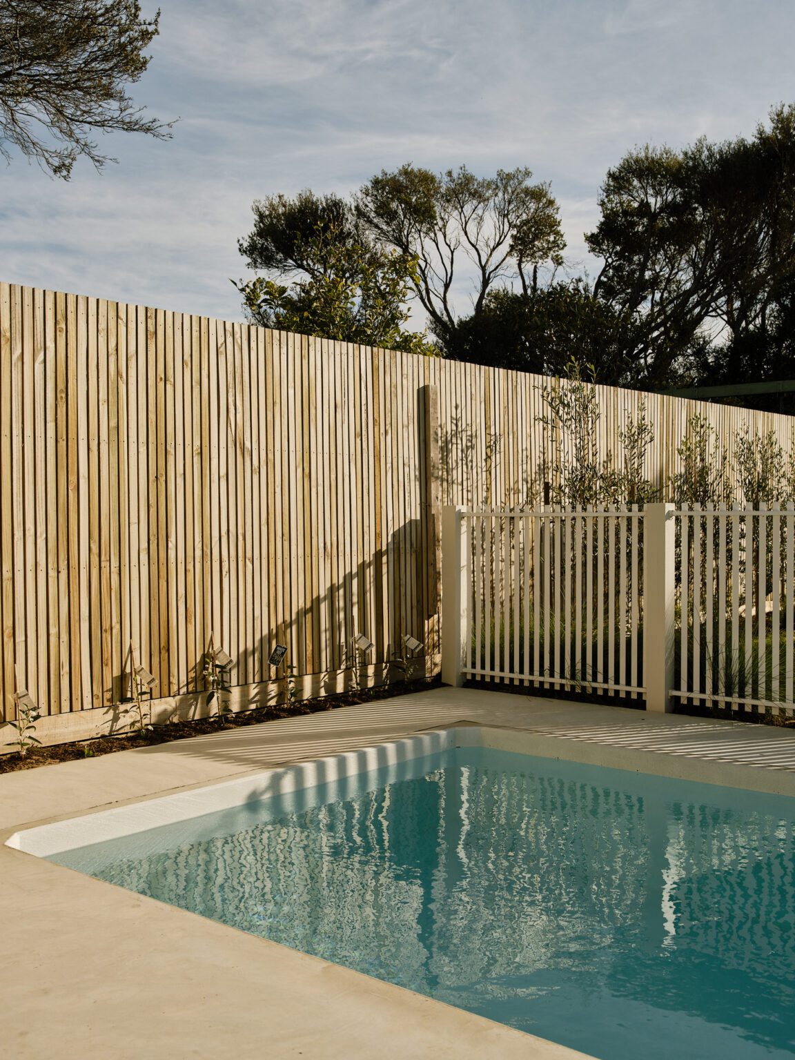 Custom timber pool fence and hardwood deck detail by Cape Build in Dunsborough